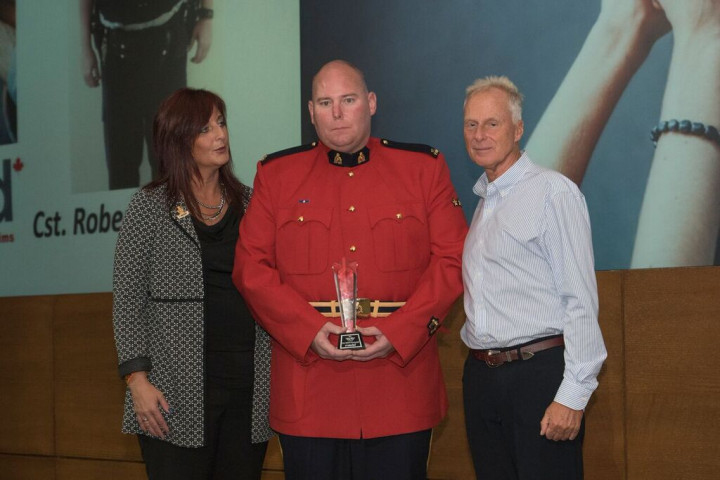 Cst. Kavanaugh (centre) holding his MADD Canada Terry Ryan Memorial Award alongside Patricia Hynes-Coates, National President of MADD Canada (left) and Andrew Murie, CEO of MADD Canada (right). Photo was taken at the MADD Canada 2017 National Leadership Conference in Toronto.