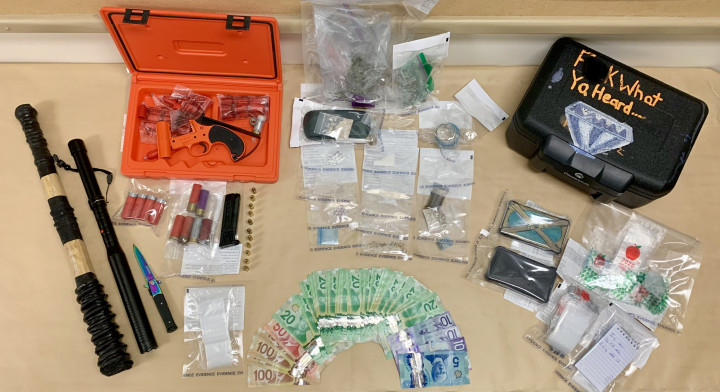 Seized drugs, cash and weapons