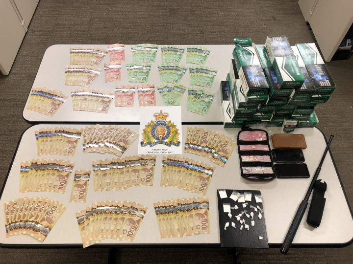 A large sum of Canadian currency, un-stamped tobacco, drugs, phones and a collapsible police baton. 