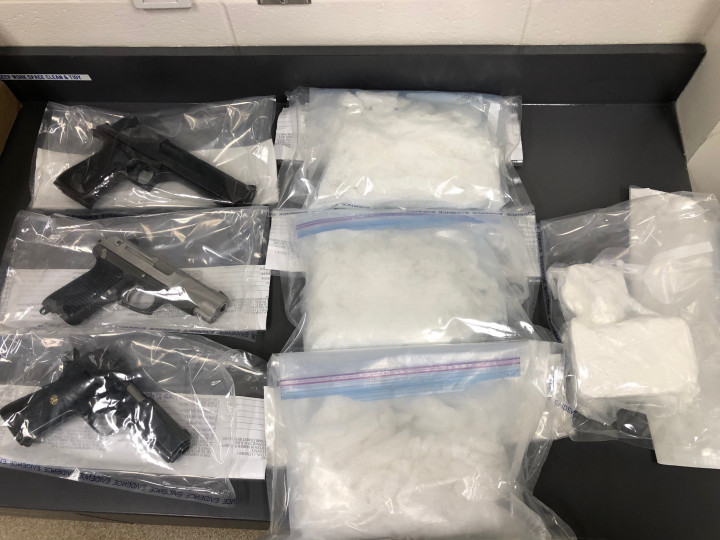  Three kilograms of methamphetamine, 0.5 kilograms of cocaine, and three handguns