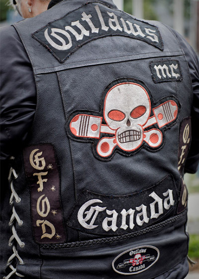 A back of an Outlaws Motorcycle Club colours leather vest with patches of the club's logo. (This photo was taken in a public place by police.)