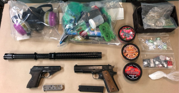 Handgun, stun baton and illegal drugs. 