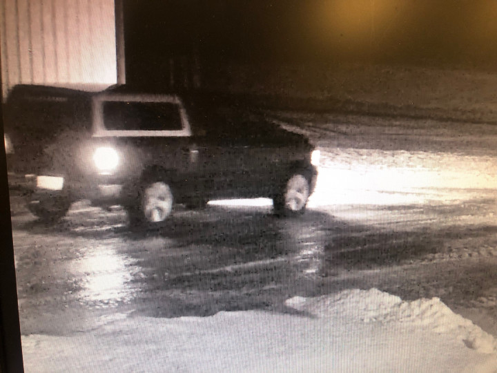 Video surveillance shows two pickup trucks on the property at the of the incident.