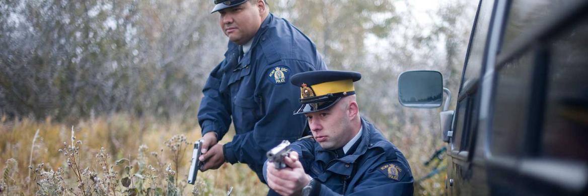 Two officers holding guns.
