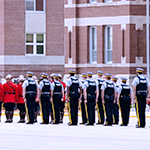 Cadets on Parade Square. Each troop has different uniform of the day on.