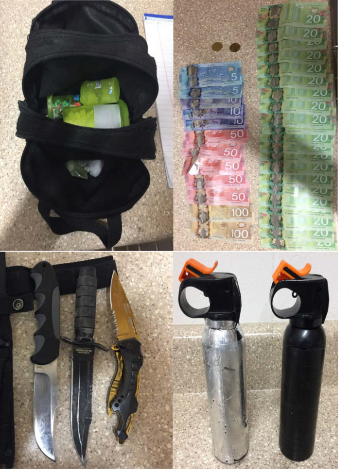 Seized weapons, drugs, and Canadian currency.
