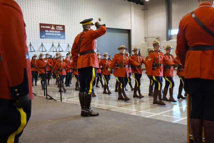 Alberta RCMP members welcome their new Commander with a ceremonial march past