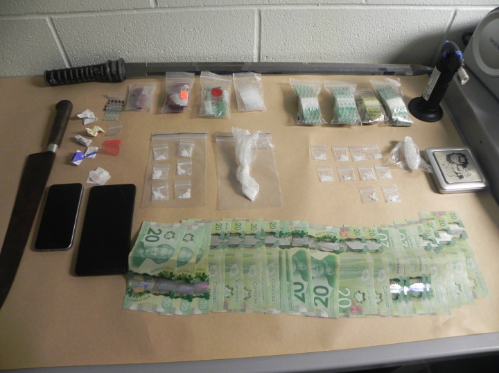 Drugs, cash, weapons and drug paraphernalia