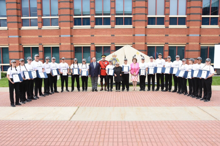 (Left to Right) Premier Jason Kenney, Deputy Commissioner Curtis Zablocki, Elder Myrtle Calahaisn, and Her Honour, The Honourable Lois Mitchell pose with the graduates of the 2nd annual Soaring Eagle Indigenous Youth Camp.