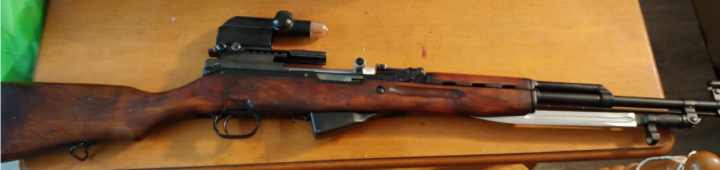 SKS .22-calibre semi-automatic rifle with a scope attached