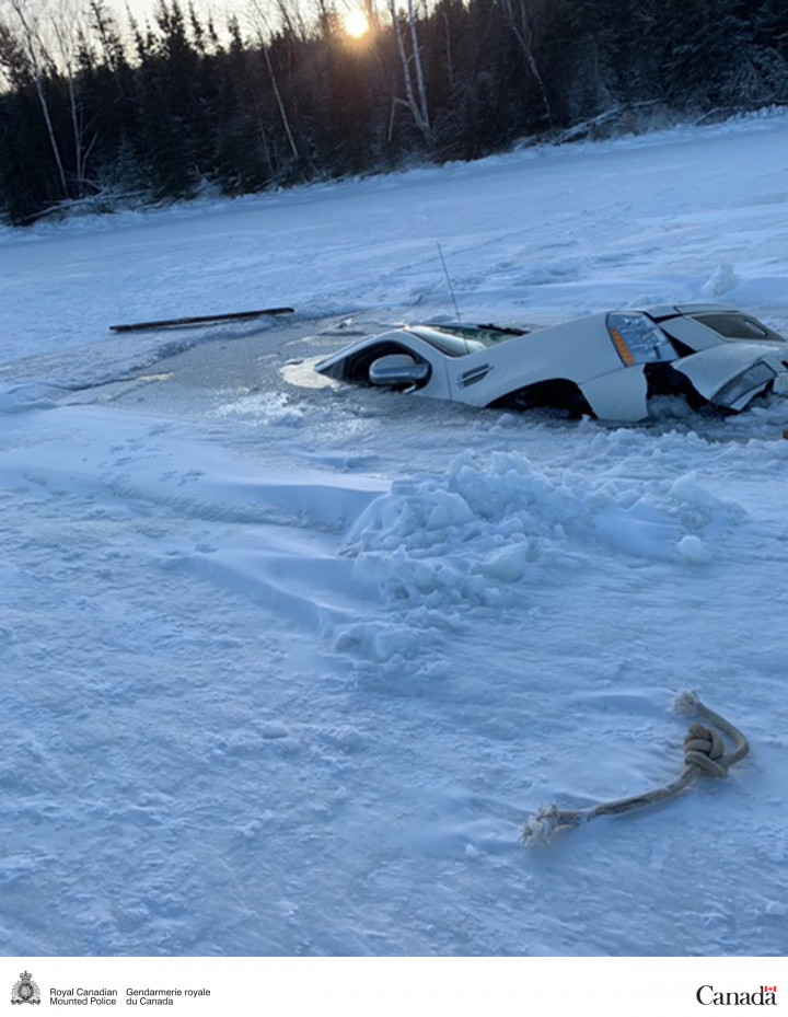 An SUV has broken through the ice.