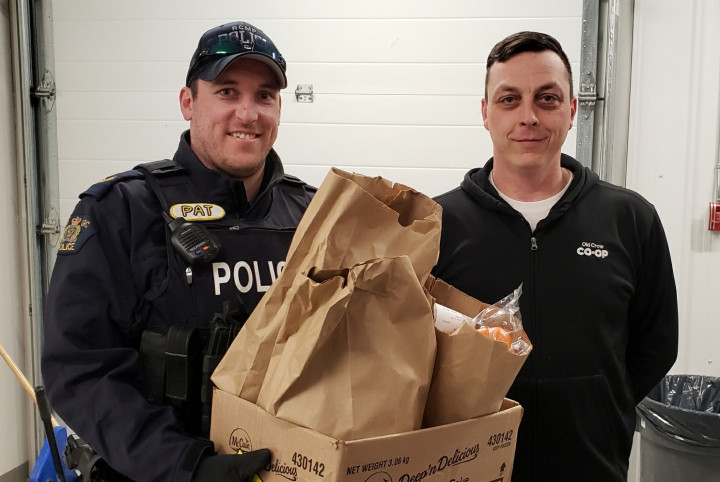 Photo of Cpl. Pat Russell and Co-Op Assistant Manager, Chris Brooks