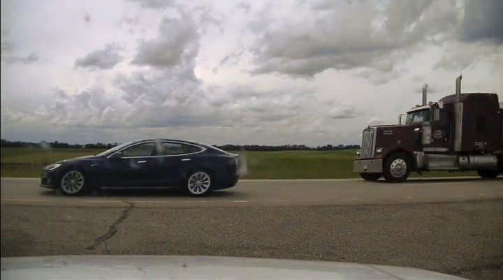 Photo of Tesla Model S with reclined seats.