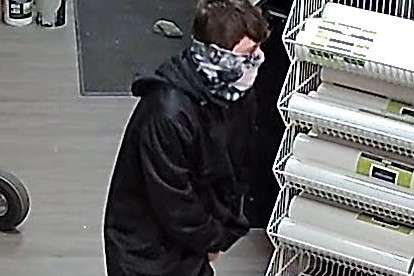 Male wearing black clothing, blue sneakers and a buff-style camouflage face mask broke into the Paint Shop in Gander on October 14, 2020.