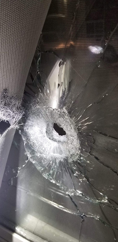 Bullet hole in window