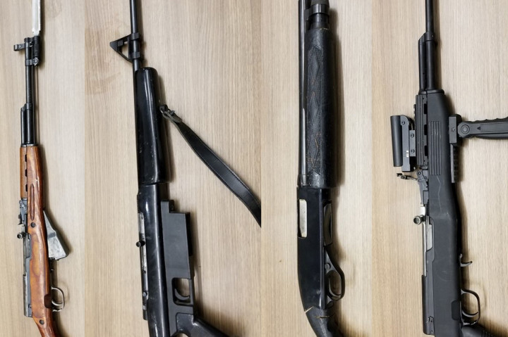 A search of the black SUV resulted in the seizure of two SKS rifles, one sawed-off shotgun, one sawed-off 22-caliber rifle and different types of ammunitions.