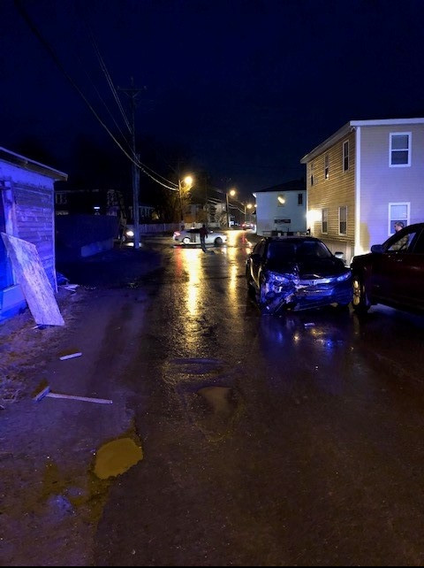A car strikes a house and another vehicle in Bay Roberts on January 9, 2021.