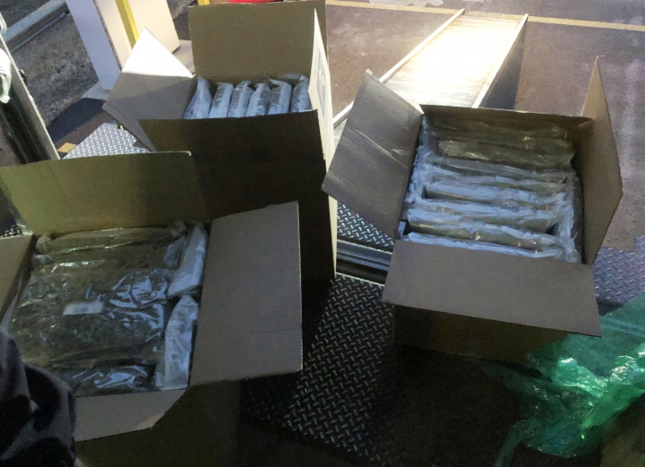 photograph depicts dried Cannabis in plastic bag packaging / several boxes