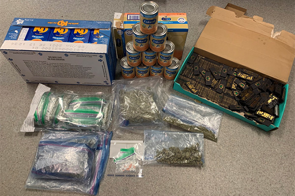 Illicit cannabis, prescription pills, alcohol, and drug trafficking paraphernalia located in altered KD and baby formula packages