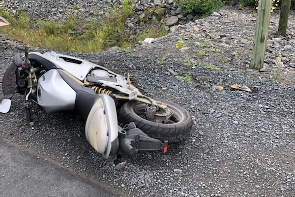 A prohibited driver, who fled from police on July 21, 2021, abandoned this motorcycle after it crashed and fled on foot into a wooded area in Carbonear.