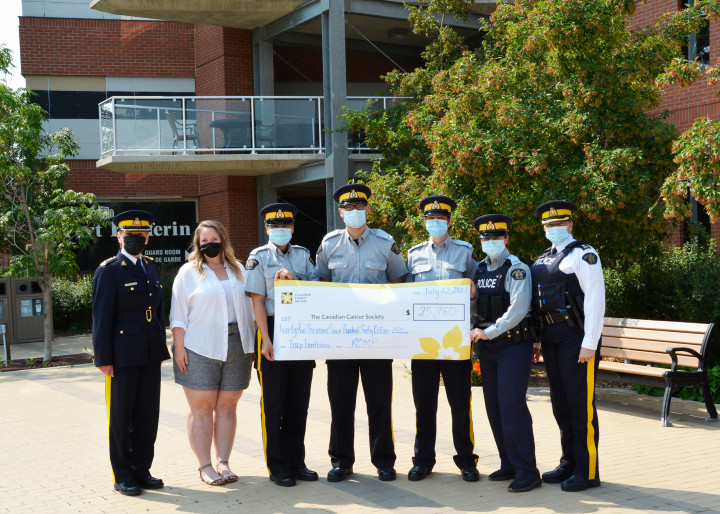 From left to right: Chief Superintendent Sylvie Bourassa-Muise, Commanding Officer Depot Division; Kristy Farn, Canadian Cancer Society; 4 RCMP cadets and Inspector Kimberley Pasloske, OIC Applied Police Services hold a presentation cheque for $25,760 raised for the Canadian Cancer Society.