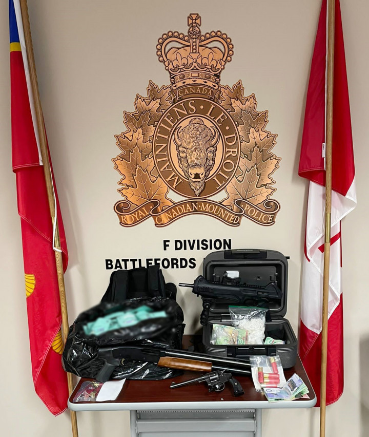 seized two illegally-modified firearms – including a semi-automatic model, a loaded handgun, hundreds of rounds of ammunition, a conducted energy device, body armour, 359 grams of cocaine, trafficking paraphernalia and a quantity of cash. 