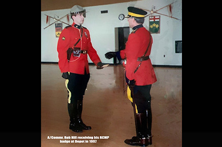 Photo of Rob Hill receiving his RCMP badge in 1997