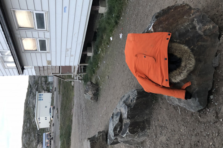 Orange jacket on a rock