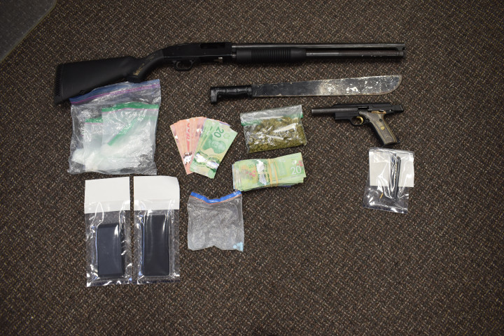 La Ronge B: loaded handgun, a small amount of pharmaceutical pills and a sum of cash.