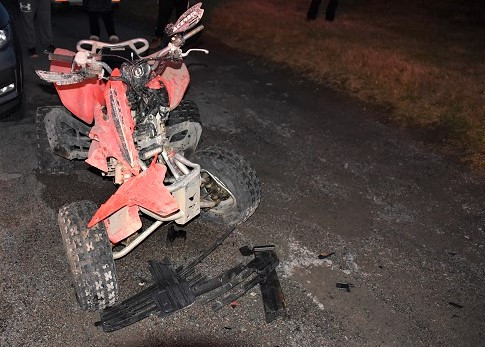 A heavily damaged all terrain vehicle is pictured. 