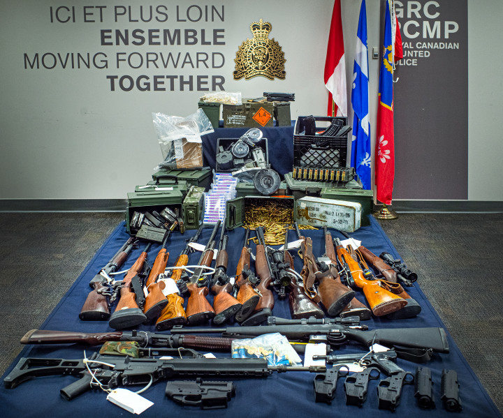 Seized firearms, weapon parts, military accessories, rounds of ammunition and high-capacity magazines