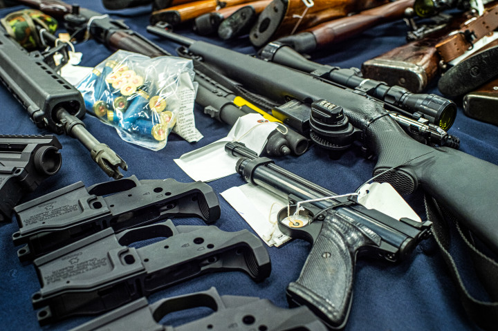 Seized firearms, weapon parts, military accessories, rounds of ammunition and high-capacity magazines