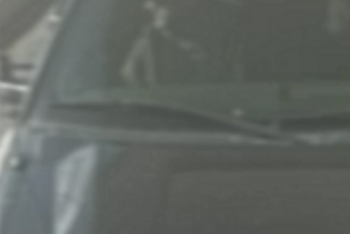 An image of a person in the front passenger seat of a Ford pickup truck