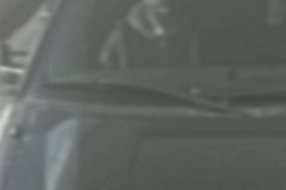 An image of a person in the front passenger seat of a Ford pickup truck