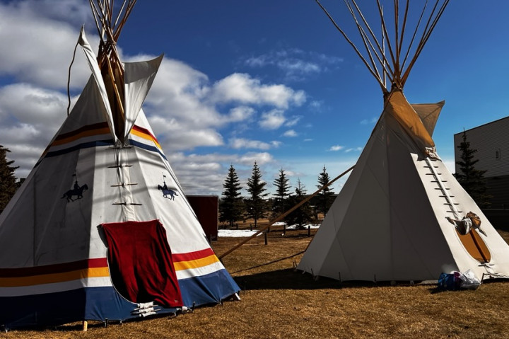 Two tipis set up outside