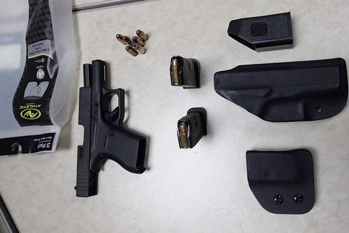 Seized firearm, ammunition and magazines.