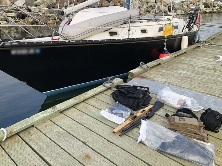 Police officers seized several firearms, magazines and ammunition, on board a sailboat.