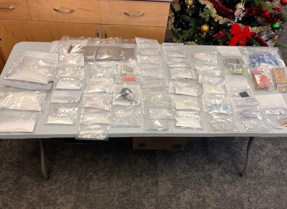 seized approximately 495 grams of cocaine, approximately 306 grams of methamphetamine, 111 LSD blotters, approximately 63 grams of an unknown substance investigators suspect to contain fentanyl, and other drug paraphernalia