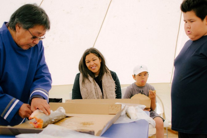 David Erkloo demonstrates and shares his knowledge on the special technique used to prepare the Artic Char in order to get it ready to dry.