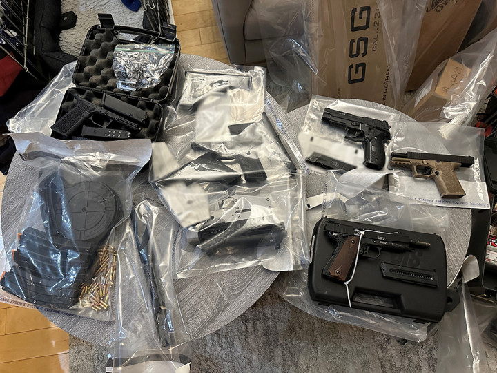 Some of the firearms, magazines and ammunition seized.