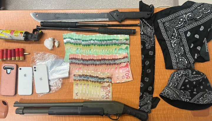 Officers located and seized approximately 3.5 grams of crack-cocaine, a large sum of cash, a loaded shotgun with a defaced serial number, ammunition, 20 grams of methamphetamine, two batons, a can of bear spray and trafficking paraphernalia.