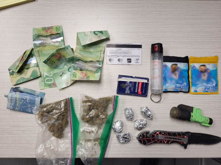 seized approximately 43 grams of crack cocaine, approximately 52 grams of methamphetamine, bear spray, brass knuckles, an imitation pistol, drug trafficking paraphernalia, and a sum of cash.