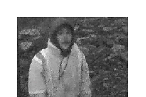 A black and white surveillance image shows an individual who is wearing a high-visibility jacket with a hood over their head.