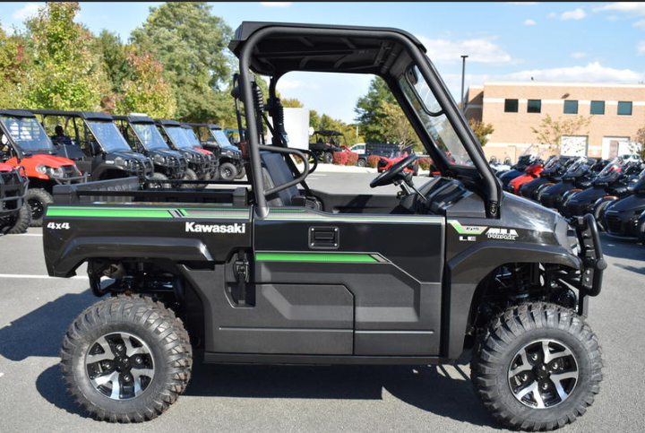 A 2023 black and green Kawasaki Mule 700 side by side ATV.
