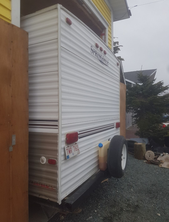 A photo of the back of a Springdale travel trailer. 