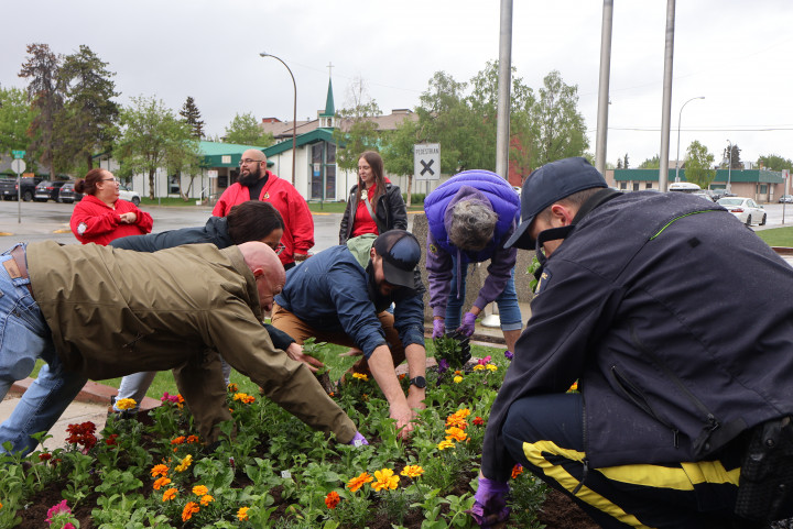 Participants planting flowers