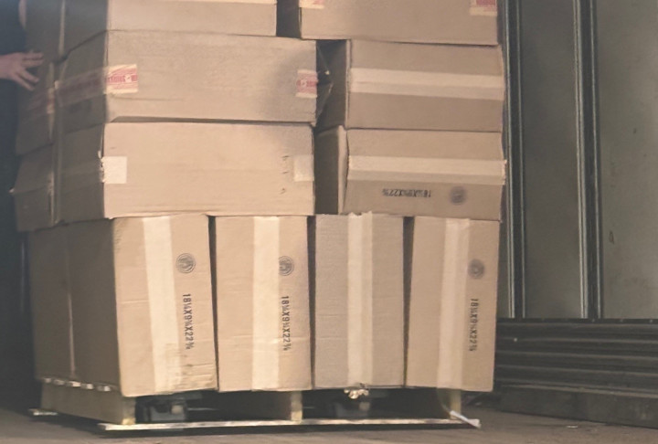 Stacks of carboard boxes containing cigarettes. 