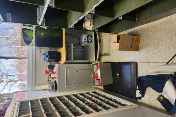 The inside of the post office; empty shelves. 