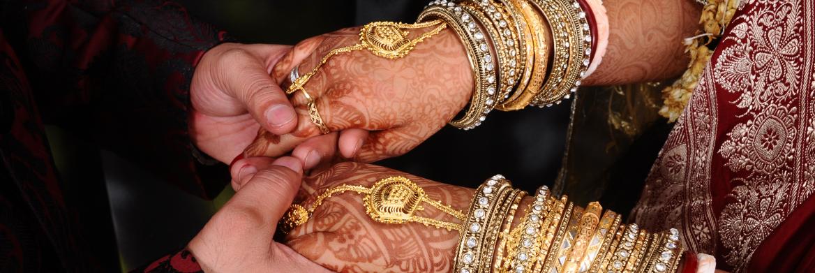Bride and groom's hands.