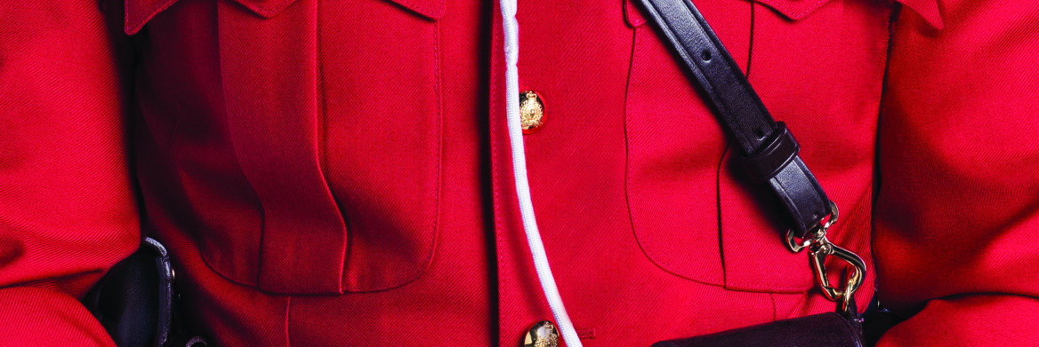 A close up of the torse of an RCMP officer dressed in red serge. 